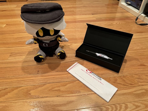 N plush and a JCJenson branded pen.